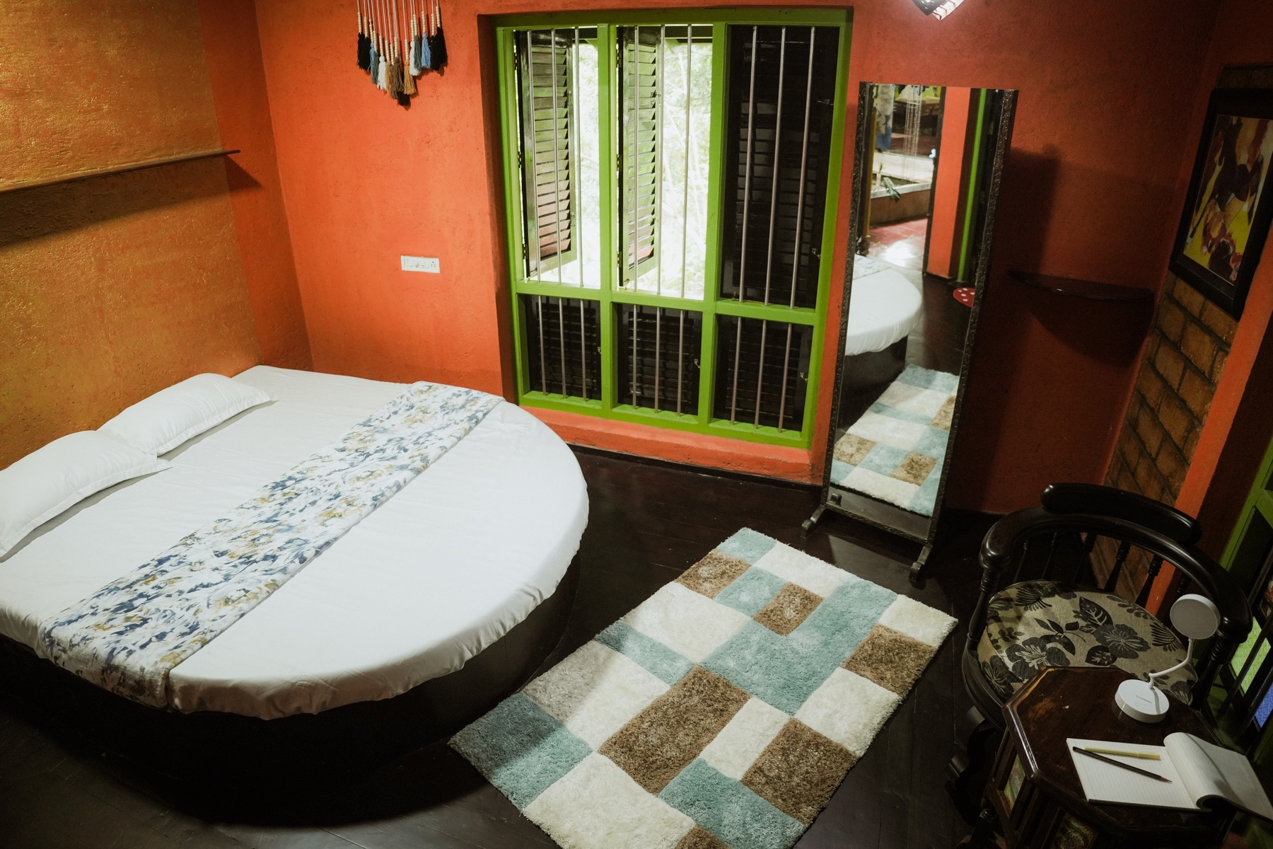 Round bed in the orange nature-view room