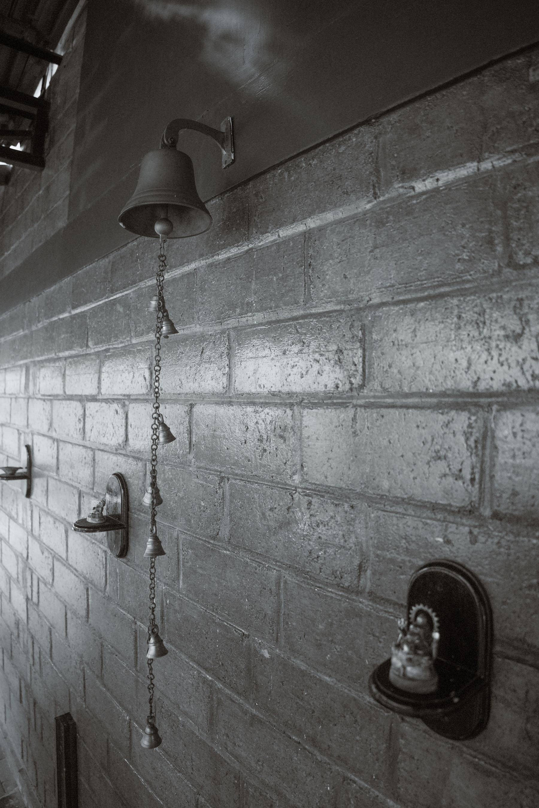 Traditional bell detail on brick wall